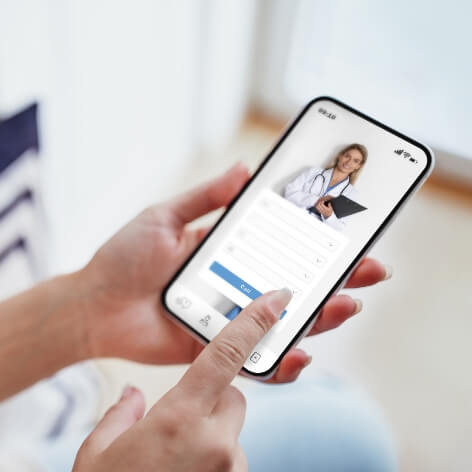 female exploring options on health app via her sma utc jpg