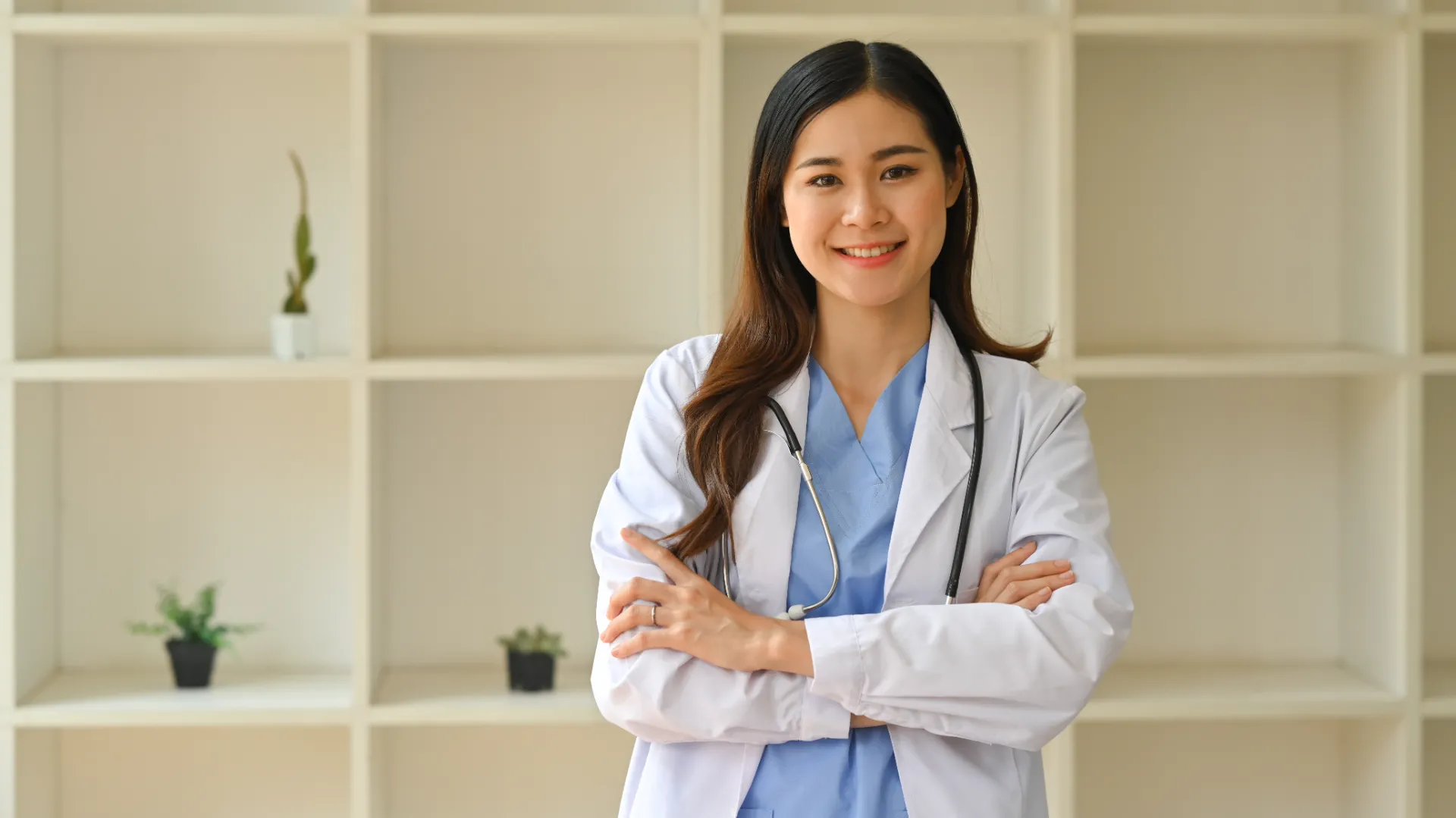 smiling young healthcare professional in workplace utc